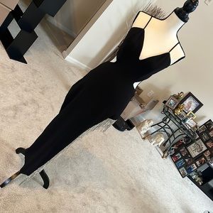 High split dress with rhinestones on the side. Size Large. Wore once for bday